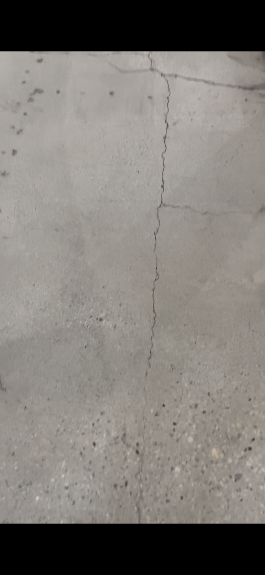 concrete spot repair, crack to be sealed, buffed, and polished.